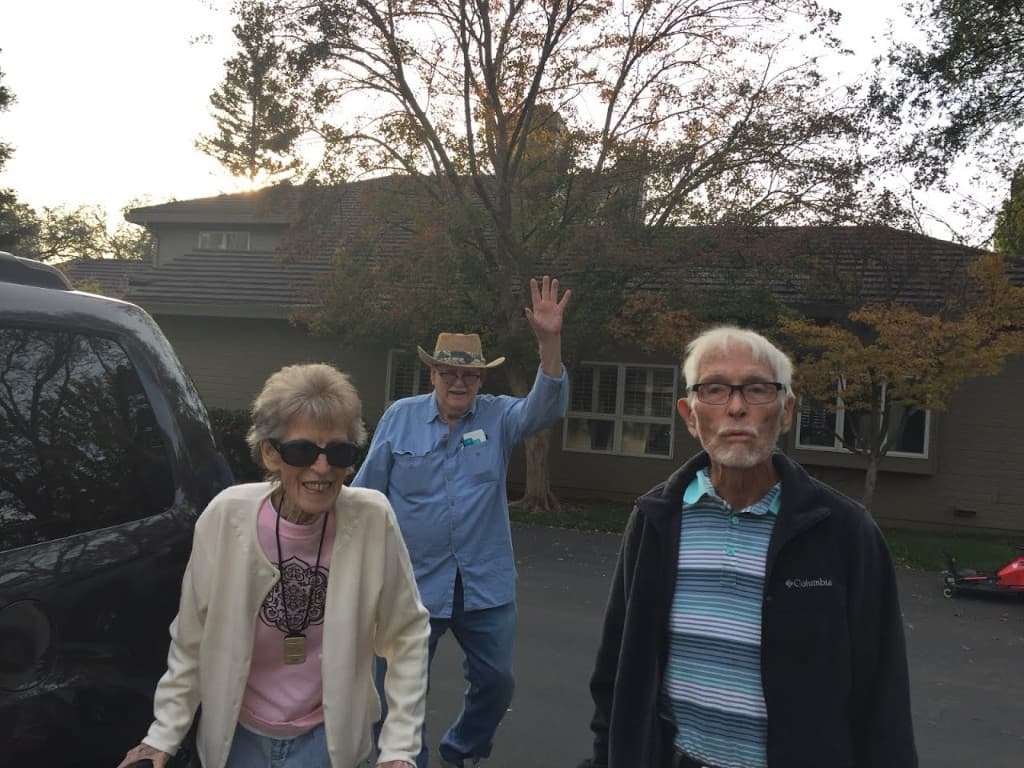 Team visiting a client at their senior living community