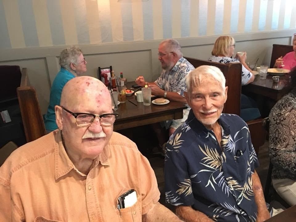 Older adult seated in wheelchair at a park